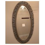 Ornate faux patina framed oval mirror, 48 x 26 in