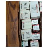 Lot of assorted standard car parts still in boxes