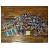 Stack of Topps/Donruss baseball cards in sleeves