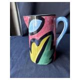 Decorative water pitcher, chip on bottom edge