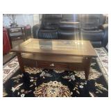 Glass top coffee table with drawer on wheels