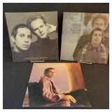 2 Simon and Garfunkel and 1 Paul Simon