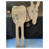 Yard decor donkey with a cowbell