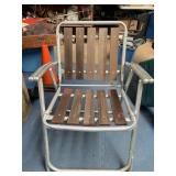 Vintage folding metal lawn chair with wood slates