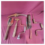 Group of Tools - grease gun, pick Ax Head, ball
