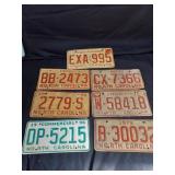 Grouping of 7 License Plates