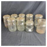 9 Glass Mason Jars,  8 are Atlas pints, 1 is 1/2