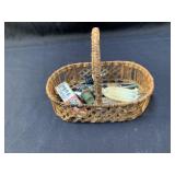 Small basket including nutcracker, can opener and