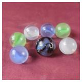7 Shooter Marbles (large colorful one has minor