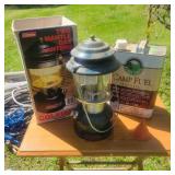 Coleman Lantern and partial container camp fuel