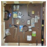 Contents of Wall - saw, levels, c-clamp, Chain