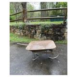 Vintage steel wheel wheel barrow needs handles,