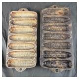 Two 7 ear corn bread pans - one is cast iron
