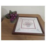 Flower arrangement and framed art by Charles