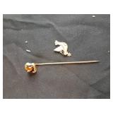 Gold dove charm and gold eye of the tiger pin