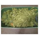 Christmas tree in a plastic tote with lid