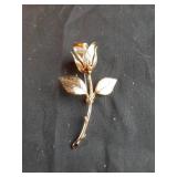 Rose gold colored brooch