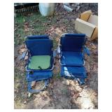 2 fold up stadium seats. 1 has an extra cushion