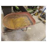 Metal wheelbarrow with flat tire