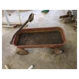 Vintage Radio Flyer wagon. Has rust