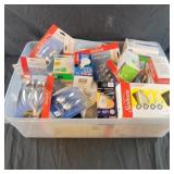 Tote (with lid) full of various sized lightbulbs