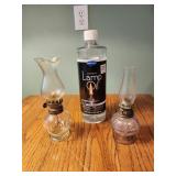 Small lanterns and a bottle of lamp oil