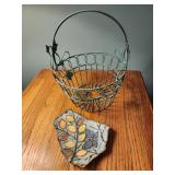 Green metal basket and butterfly pottery