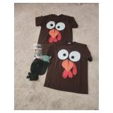 2 large turkey shirts, beads and a bonnet