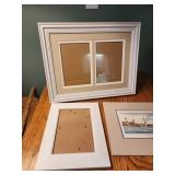 2 white picture frames. Nc lighthouse art