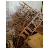 Approximately 11 wood chairs. 1 rocking chair.