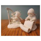 Snowbabies playing harp, making a list