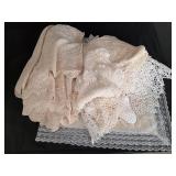 Various handmade dollies, runners and table