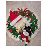 Wreath rug, doorknob snowman, hat, candle light