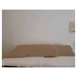 Set of tan in color MKS car floor mats