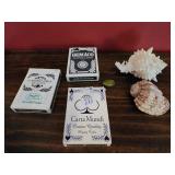 Playing cards and shells
