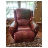 Red leather recliner shows wear rocker swivel
