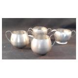 2 sets of pewter creamers and sugar bowls