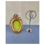 Bathroom towel holder with tags, gold color photo