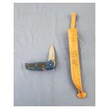 Blue pocket knife and a sheath wothout a knife