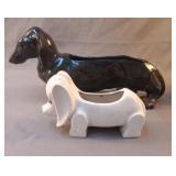 2 Datshound ceramic planters. The black 1 has
