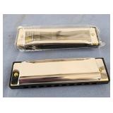 2 harmonicas plastic