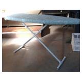 Metal collapsible ironing board with reversible