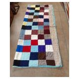 Handmade reversible quilt 66 x 80. Tiny hole