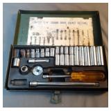 Metal box with 1/4" square drive socket set.