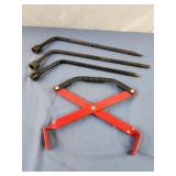 3 tire irons and a battery carrier