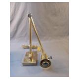 Brass colored desk lamp. Extends up to 20"