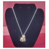 Silver colored necklace 9.5" long with flower