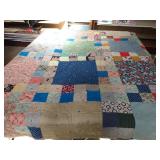 Handmade reversible quilt 68 x 84. Has holes and