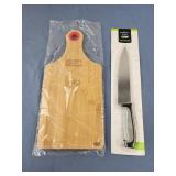 Chef knife new in package , small cutting board
