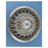 Cadillac hub cap. Has a couple of small